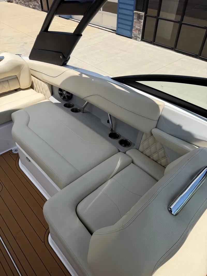 Slide: The Image of Interior of a 2021 Regal LX2 boat with beige upholstery and sleek details. - 13