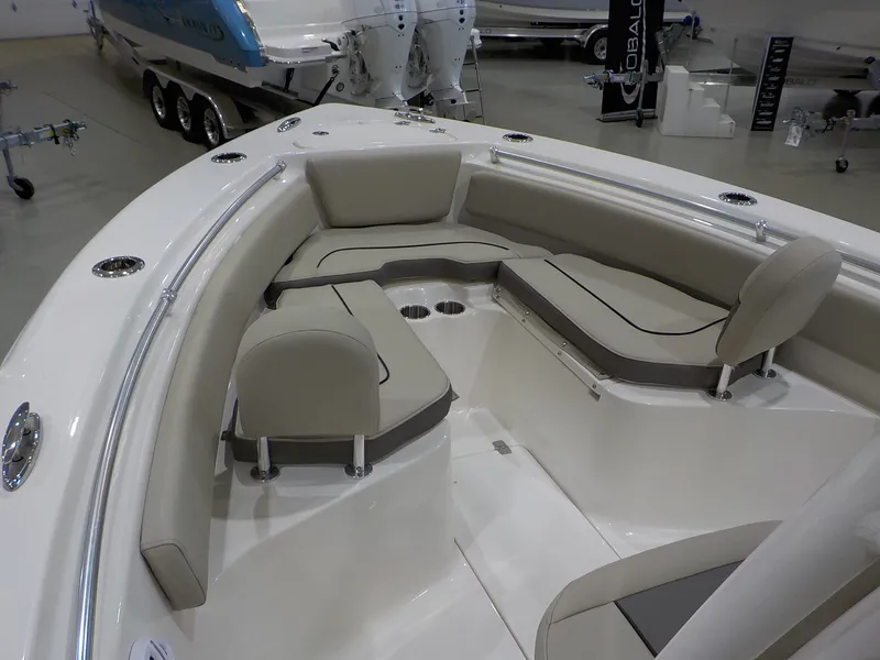 Slide: The Image of The image shows the bow area of a Key West 239 FS boat with cushioned seating. - 10