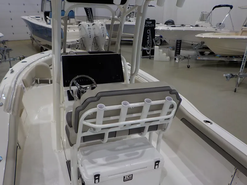Slide: The Image of The image shows the cockpit of a Key West 239 FS boat with helm and seating. - 13