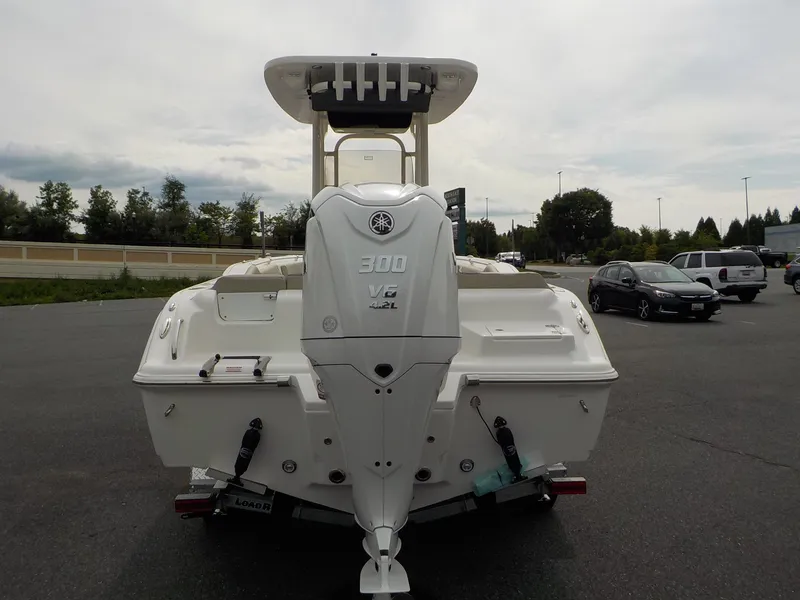 Slide: The Image of A 2027 Key West 239 FS boat with a 300 HP Yamaha outboard motor, parked on a trailer. - 9