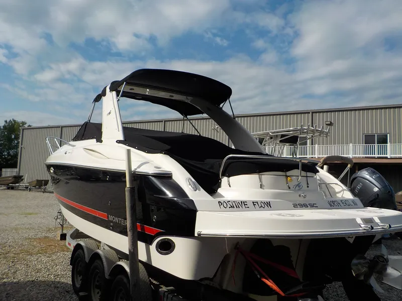 Slide: The Image of A 2006 Monterey 298SC Super Sport boat on a trailer in front of a building. - 4