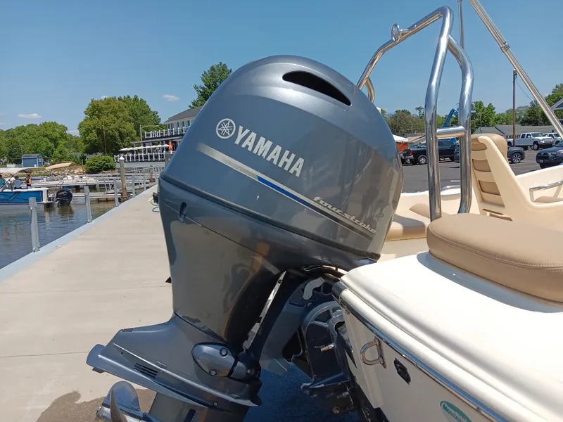 Slide: The Image of A 2020 Scout 175 Sport Dorado with a Yamaha outboard motor at the dock. - 16