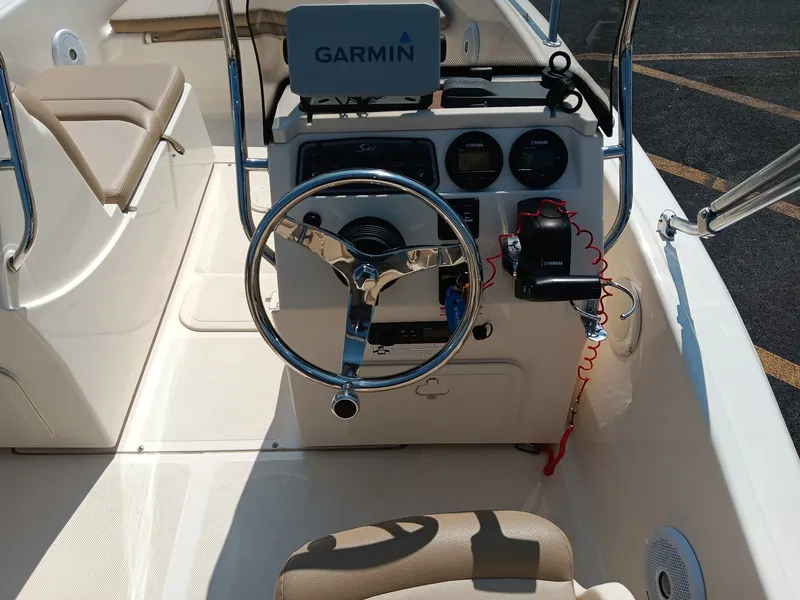 Slide: The Image of The image shows the cockpit of a 2020 Scout 175 Sport Dorado boat with Garmin navigation. - 9