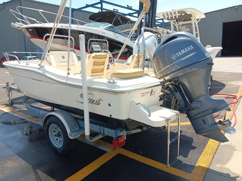 Slide: The Image of A 2020 Scout 175 Sport Dorado boat on a trailer, featuring a Yamaha outboard motor. - 17