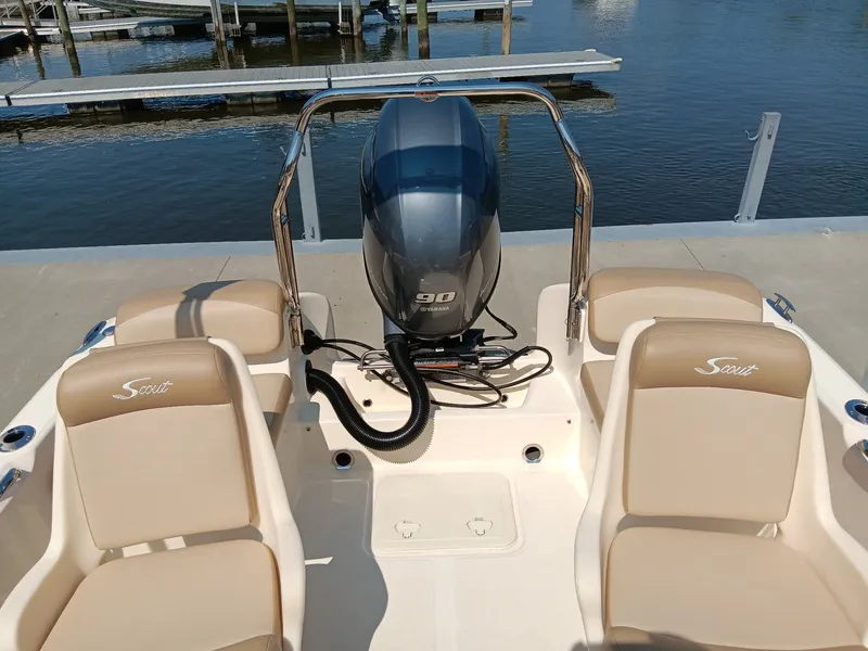 Slide: The Image of The image shows the cockpit of a 2020 Scout 175 Sport Dorado boat with a 90 HP engine. - 11