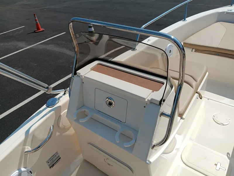 Slide: The Image of The image shows the cockpit of a 2020 Scout 175 Sport Dorado with a helm console and seating area. - 7