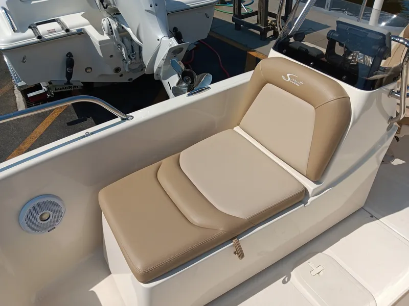 Slide: The Image of The image shows a beige and cream seat on a Scout 175 Sport Dorado boat. - 4