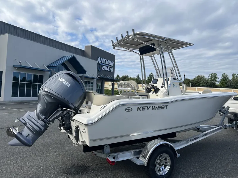 Slide: The Image of A 2027 Key West 203 FS boat on a trailer in front of a building labeled "Anchor Boats." - 5