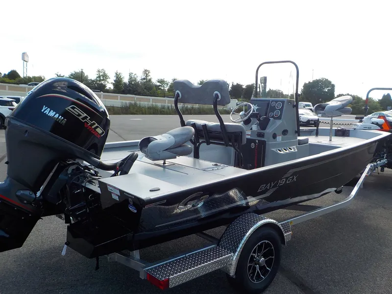 Slide: The Image of A 2026 G3 Bay 19 GX boat on a trailer. It features a Yamaha engine. - 6