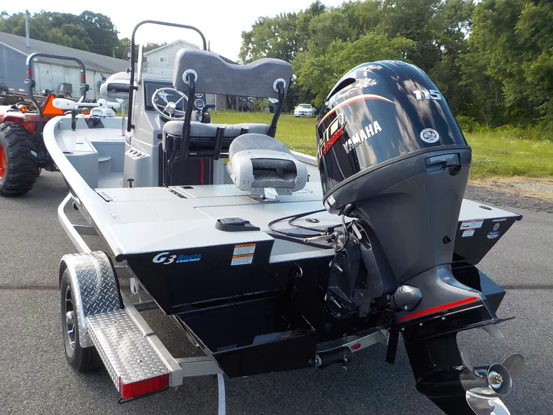 Slide: The Image of A 2026 G3 Bay 19 GX boat with a Yamaha 115 engine, on a trailer. - 8