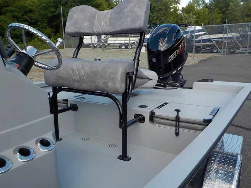 Slide: The Image of The image shows the cockpit of a G3 Bay 19 GX boat with gray seats and an outboard motor. - 10
