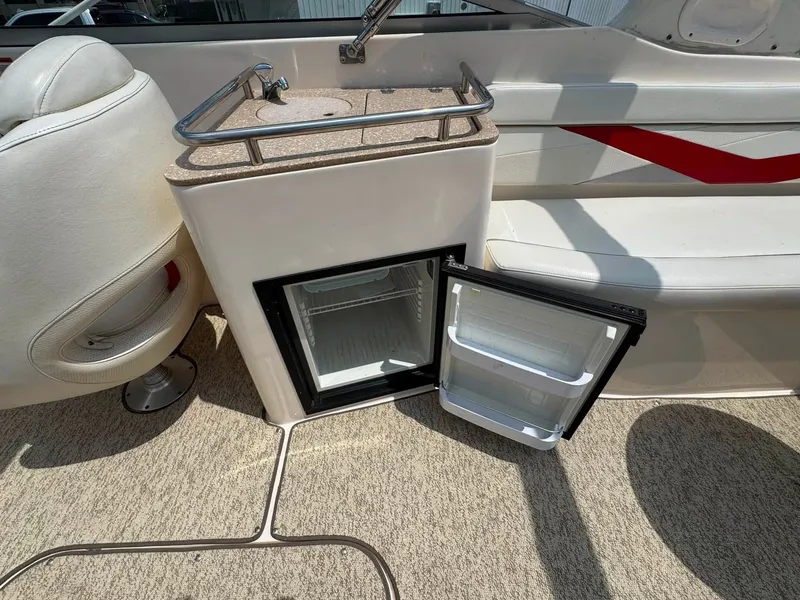 Slide: The Image of The image shows an open refrigerator on a boat, surrounded by white seating. - 8