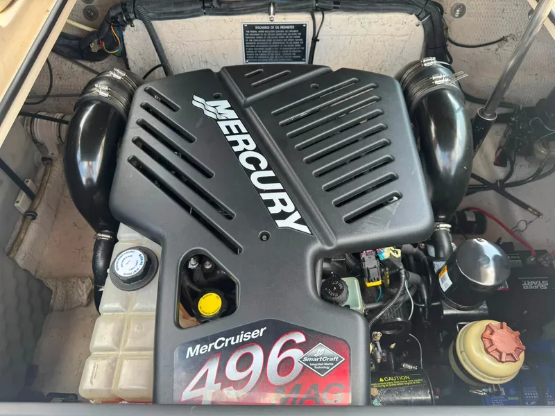 Slide: The Image of The engine compartment of a 2006 Rinker 282 BR features a Mercury MerCruiser 496 MAG engine. - 3