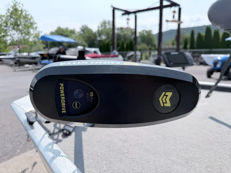Slide: The Image of A Minn Kota PowerDrive motor is mounted on a boat, surrounded by other boats outdoors. - 15