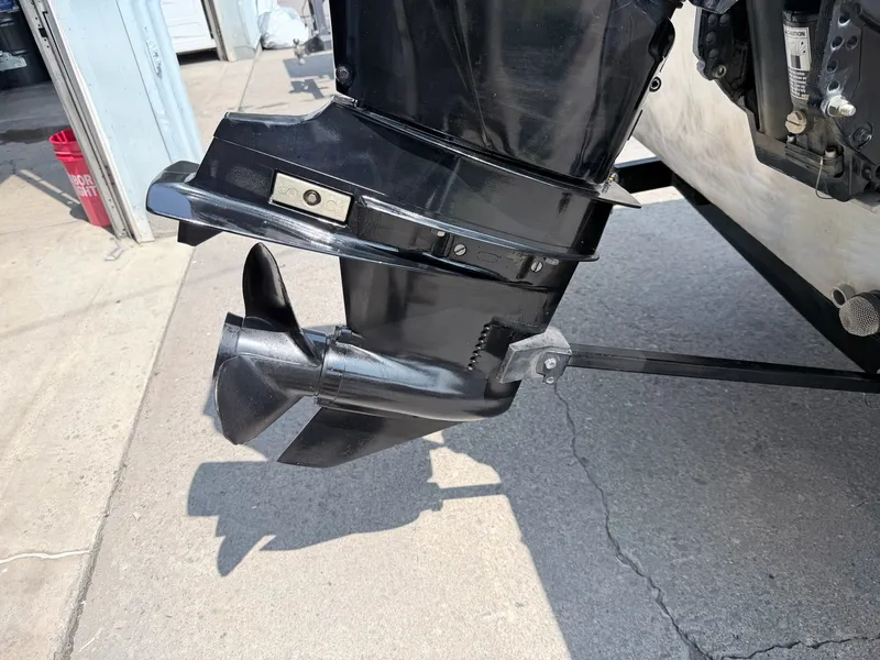 Slide: The Image of Close-up of an outboard motor on a boat, resting on a concrete floor. - 23