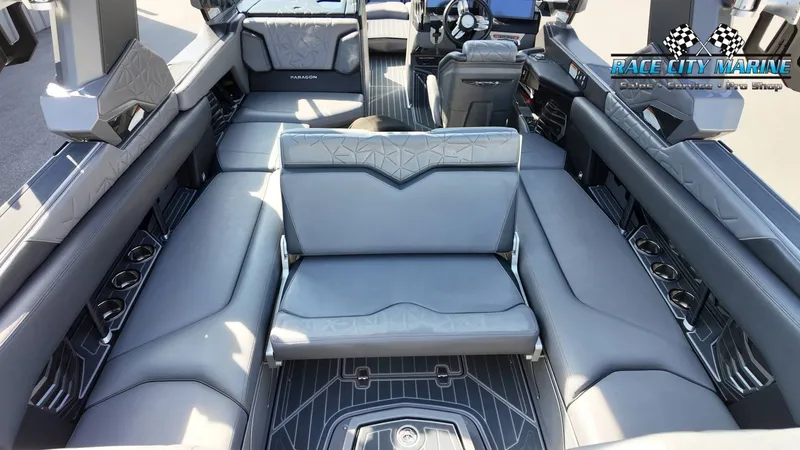 Slide: The Image of The image shows the luxurious interior of a 2022 Nautique Super Air Nautique G25 Paragon with gray upholstery. - 48