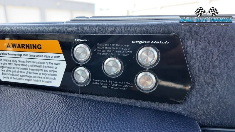 Slide: The Image of Close-up of a control panel with buttons for tower and engine hatch, next to a warning. - 17