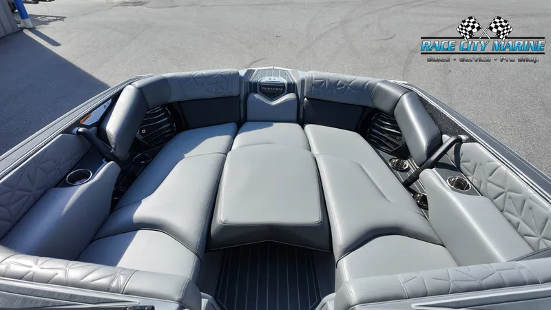 Slide: The Image of The image shows the luxurious gray upholstery of the 2022 Super Air Nautique G25 Paragon. - 26