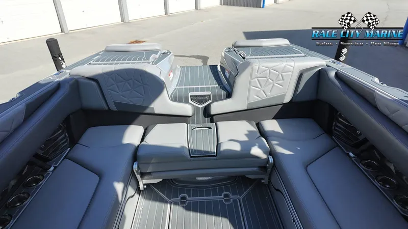 Slide: The Image of The image shows the luxurious interior of a 2022 Nautique Super Air Nautique G25 Paragon with gray upholstery. - 45