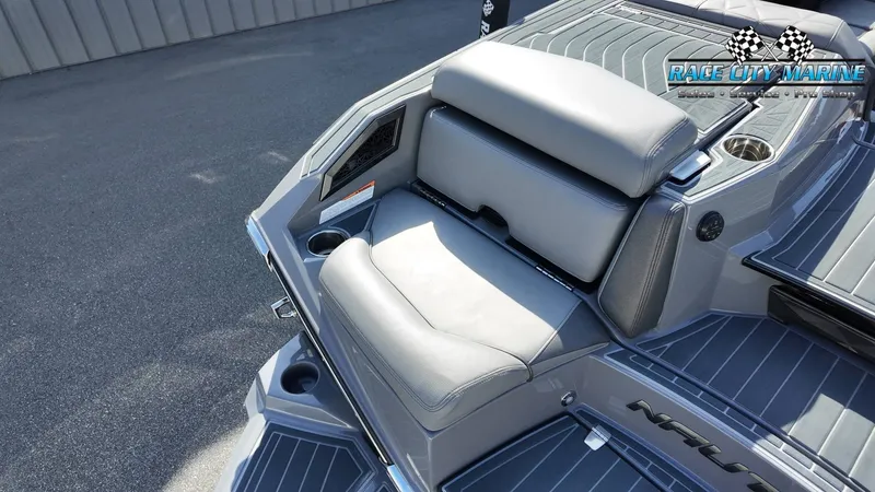 Slide: The Image of The image shows the stern of a 2022 Nautique Super Air Nautique G25 Paragon with gray upholstery. - 39