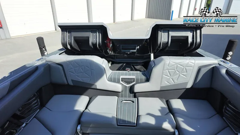 Slide: The Image of The image shows the interior of a 2022 Nautique Super Air Nautique G25 Paragon with gray upholstery and modern details. - 47