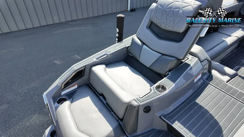 Slide: The Image of The image shows the luxurious gray upholstery of a 2022 Nautique Super Air Nautique G25 Paragon. - 41