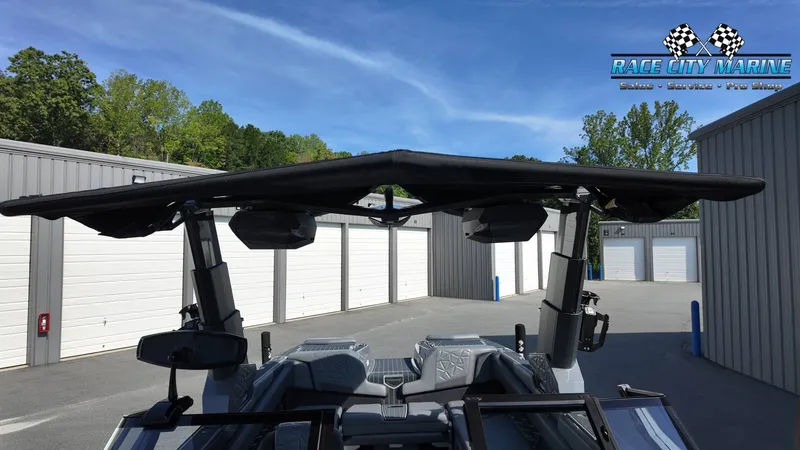 Slide: The Image of The image shows the sunshade of a 2022 Nautique Super Air Nautique G25 Paragon. - 33