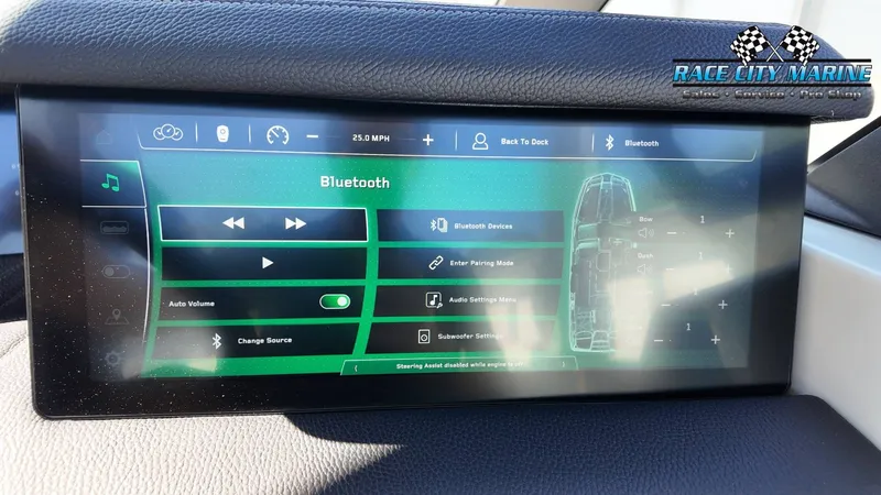 Slide: The Image of The image shows the touchscreen display of a 2022 Nautique Super Air Nautique G25 Paragon. - 19