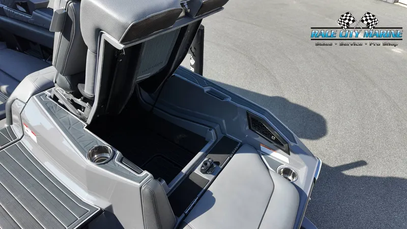 Slide: The Image of The image shows the interior of a 2022 Nautique Super Air Nautique G25 Paragon with gray upholstery. - 44