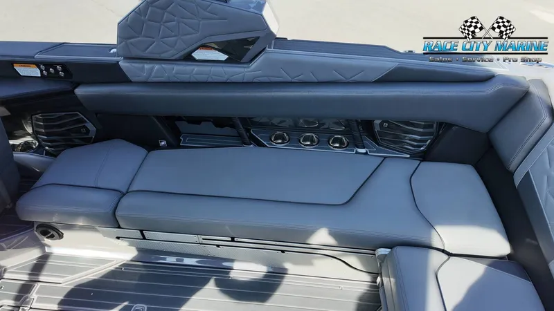 Slide: The Image of The image shows the luxurious interior of a 2022 Nautique Super Air Nautique G25 Paragon with gray upholstery. - 49