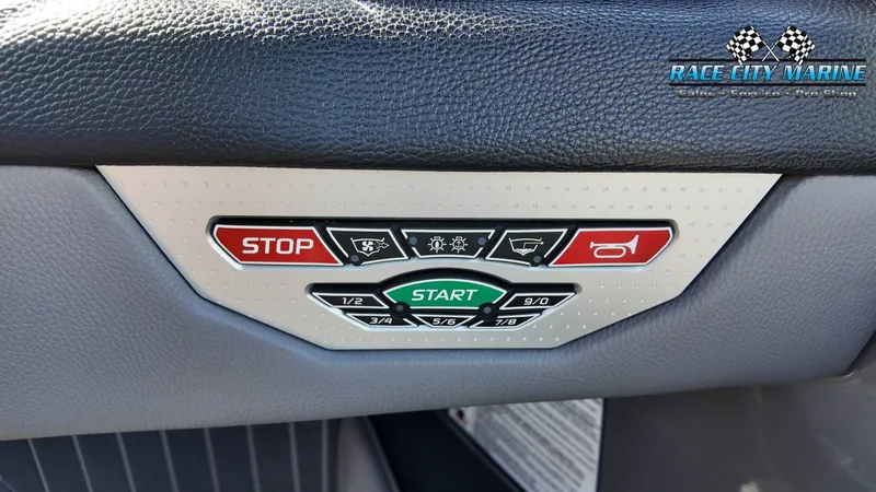Slide: The Image of Close-up of the control panel with start and stop buttons and various indicator lights. - 24