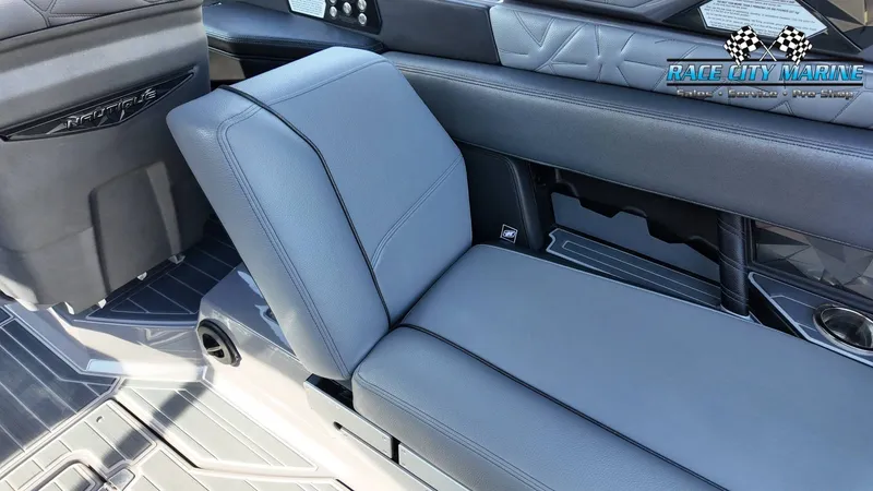 Slide: The Image of The image shows the interior of a 2022 Nautique Super Air Nautique G25 Paragon with gray upholstery. - 50