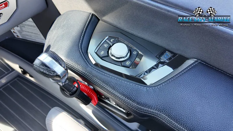 Slide: The Image of Close-up of a control knob and lever on a boat, surrounded by black leather. - 14