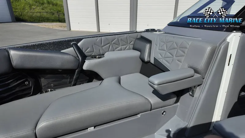 Slide: The Image of The image shows the luxurious gray interior of a 2022 Nautique Super Air Nautique G25 Paragon boat. - 31