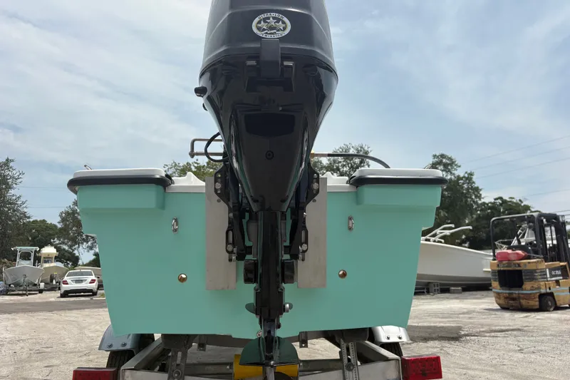 Slide: The Image of Rear view of 2025 Exuma 14 Snookaholic boat on trailer, showcasing outboard motor. - 11