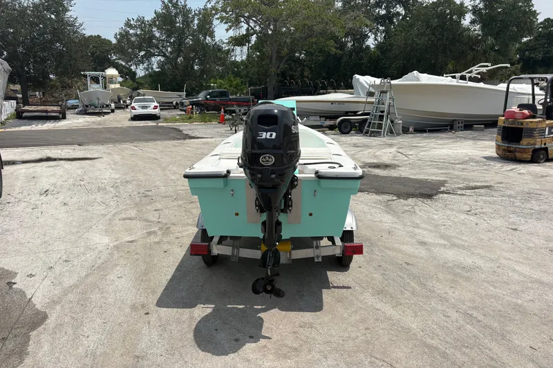 Slide: The Image of Exuma 14 Snookaholic 2025 boat on trailer, parked in a boatyard. - 4
