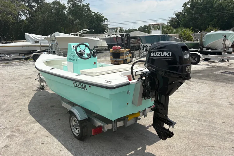 Slide: The Image of 2025 Exuma 14 Snookaholic boat with Suzuki 30 engine on trailer. - 2