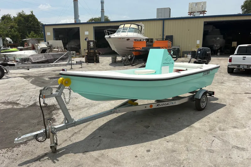 Slide: The Image of 2025 Exuma 14 Snookaholic boat on trailer in industrial yard setting. - 8