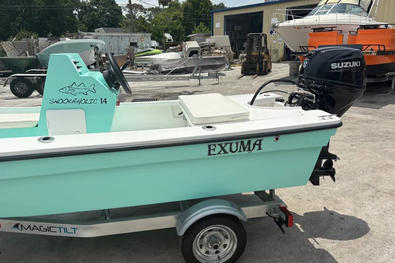 Slide: The Image of 2025 Exuma 14 Snookaholic boat on trailer with Suzuki outboard motor. - 6