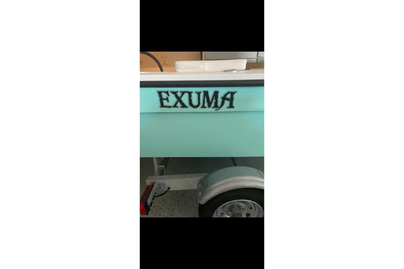 Slide: The Image of 2026 Exuma 14 Snookaholic boat trailer with turquoise finish and bold lettering. - 3