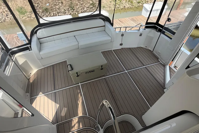 Slide: The Image of Spacious aft cabin of 2005 Carver 396 Motor Yacht with seating and wooden flooring. - 3