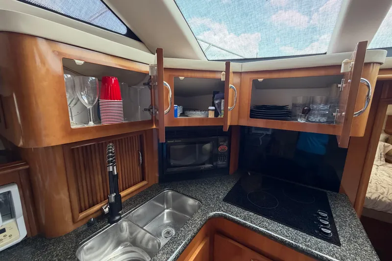 Slide: The Image of Luxurious kitchen in 2005 Carver 396 Aft Cabin Motor Yacht with modern amenities. - 13