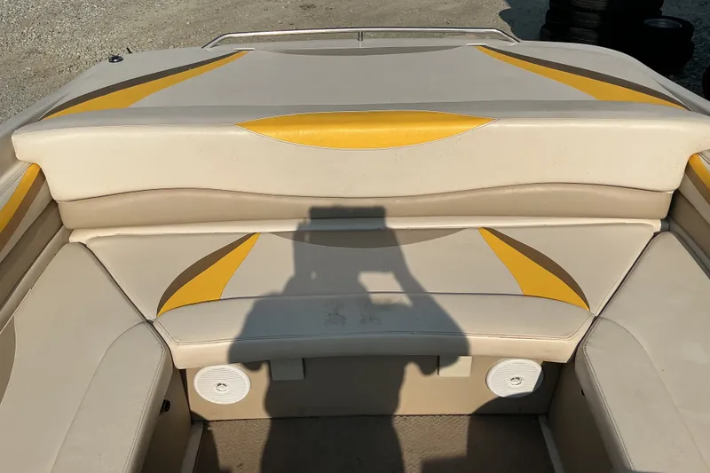 Slide: The Image of 2003 Glastron GX 225 boat interior with beige and yellow seating design. - 19