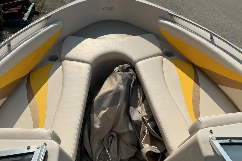 Slide: The Image of 2003 Glastron GX 225 boat interior with yellow and beige seating. - 15