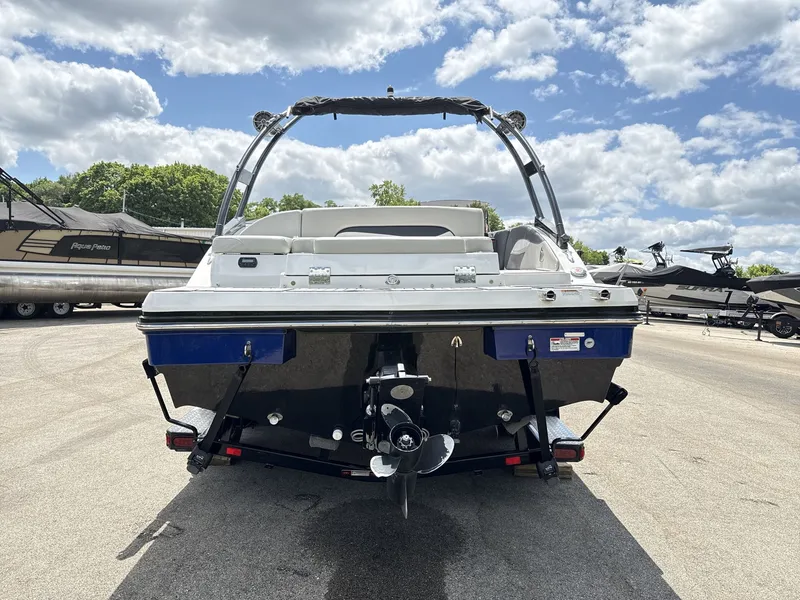 Slide: The Image of A 2015 Starcraft 211 SCX boat on a trailer under a cloudy sky. - 5