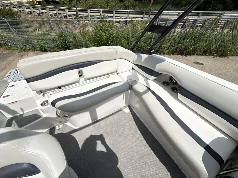 Slide: The Image of Interior of a 2015 Starcraft 211 SCX with white and gray seating. - 19