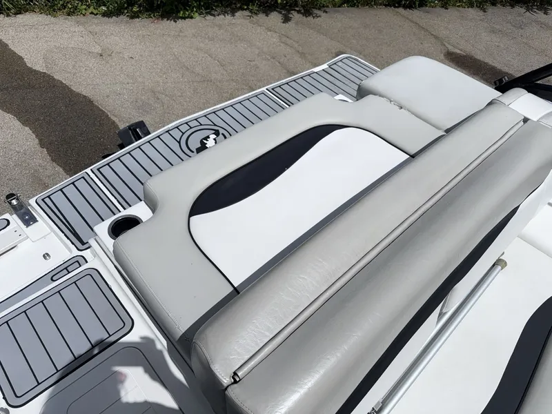 Slide: The Image of The image shows the stern of a Starcraft 211 SCX boat with gray and white upholstery. - 15