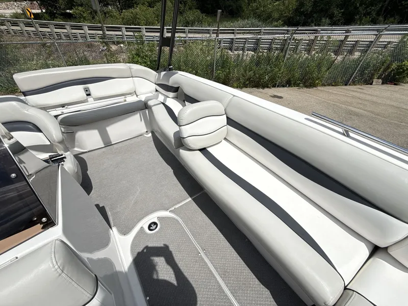 Slide: The Image of The image shows the spacious cockpit of a 2015 Starcraft 211 SCX with white upholstery. - 21