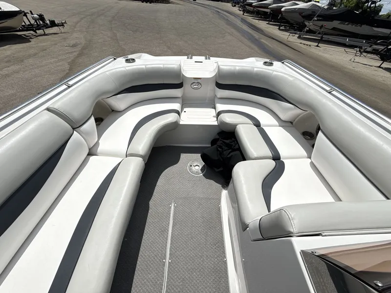 Slide: The Image of The image shows the spacious cockpit of a 2015 Starcraft 211 SCX with white upholstery. - 20