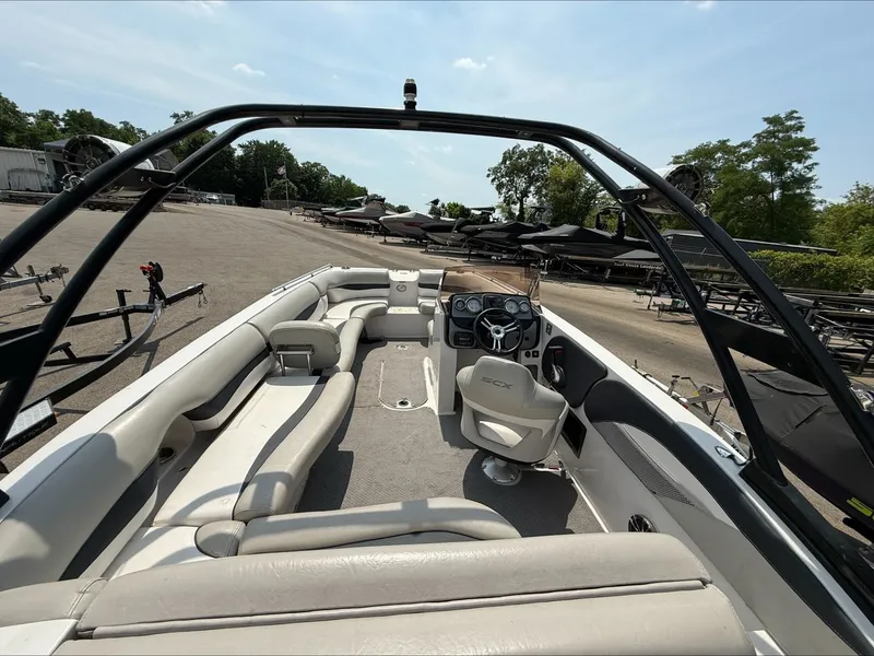 Slide: The Image of The image shows the cockpit of a 2015 Starcraft 211 SCX with beige seating and a black steering wheel. - 9